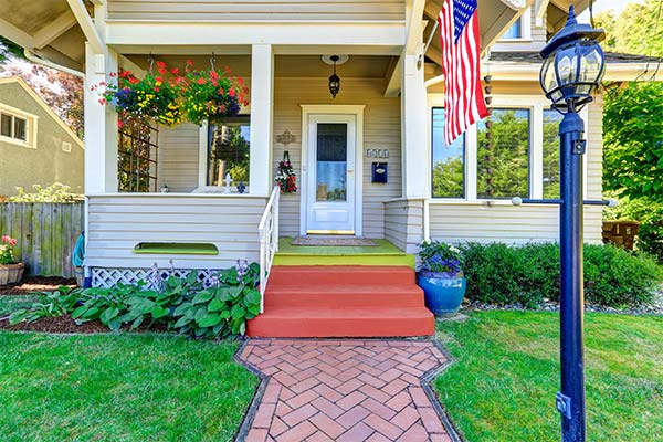 single-family house with american flag out front